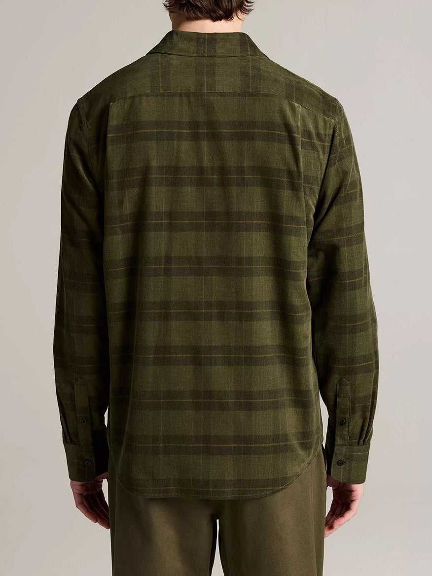 Person wearing the Vince Hamilton Plaid Cotton Corduroy Button-Front Shirt in Night Leaf Combo and green pants, shown from the back against a plain background.