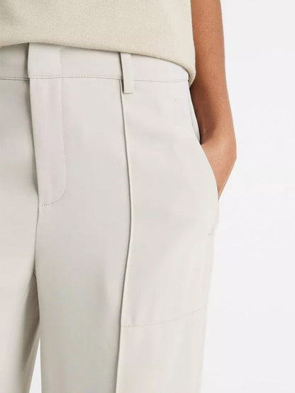 Close-up of a person wearing Vince Crepe Wide-Leg Utility Pant in Sepia with a hand in the pocket.