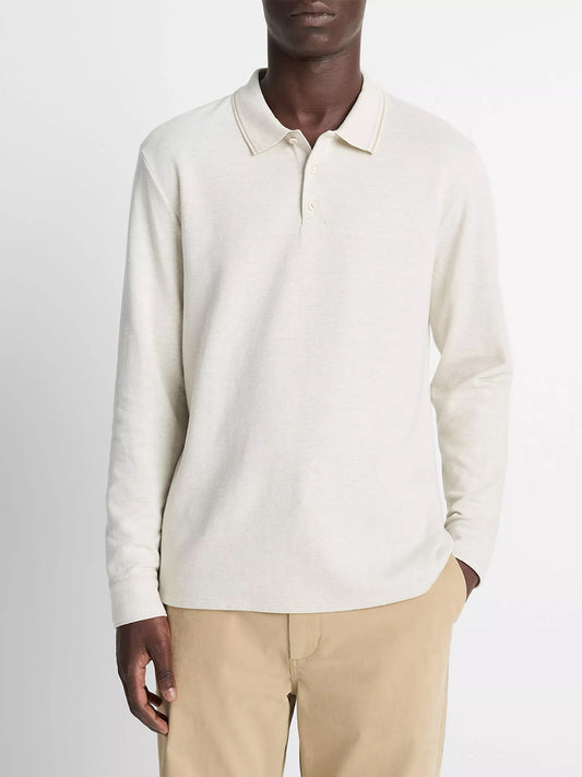 A person wears the Vince Heathered Double-Face Cotton-Blend Polo Shirt in Heather Blanco/Terrapin with tan pants, standing against a plain white background.