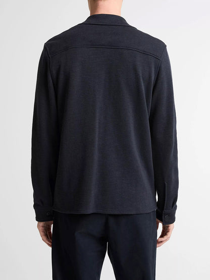 A person is shown from the back against a plain light background, wearing the Vince Double-Slub Cotton-Blend Shirt Jacket in Coastal Blue with matching pants.
