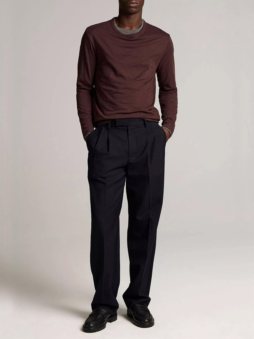 A man wears the Vince Slub Pima Cotton Double-Layer T-Shirt in Chocolate Plum/Medium Heather Grey, paired with black trousers and shoes against a plain background.