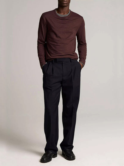 A man wears the Vince Slub Pima Cotton Double-Layer T-Shirt in Chocolate Plum/Medium Heather Grey, paired with black trousers and shoes against a plain background.