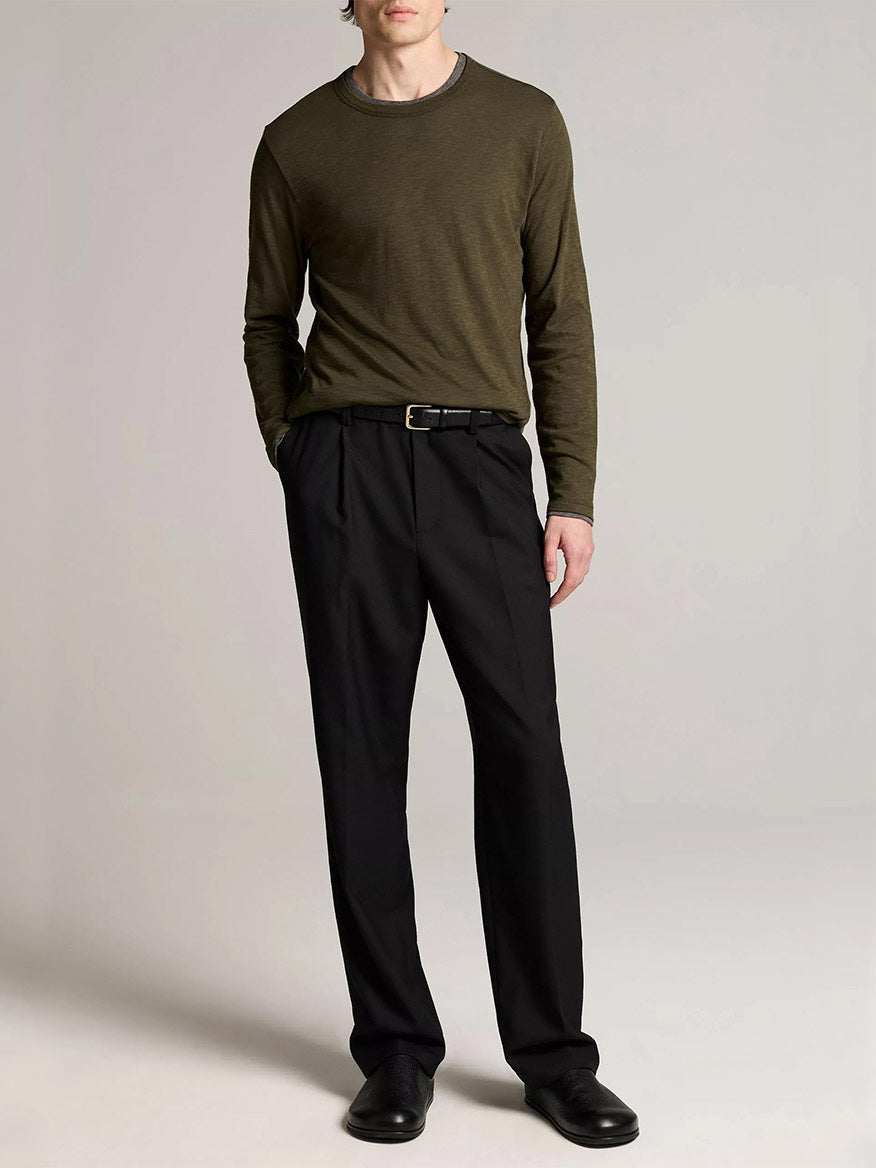 A person wears the Vince Slub Pima Cotton Double-Layer T-Shirt in Night Leaf/Medium Heather Grey, black belt, trousers, and shoes—ideal for layering against a plain backdrop.