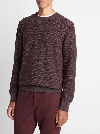 A man wears the Vince Geo-Jacquard Wool-Blend Crew Neck Sweater in Port/Medium Heather Grey over a white undershirt with matching maroon pants, standing against a plain white background.