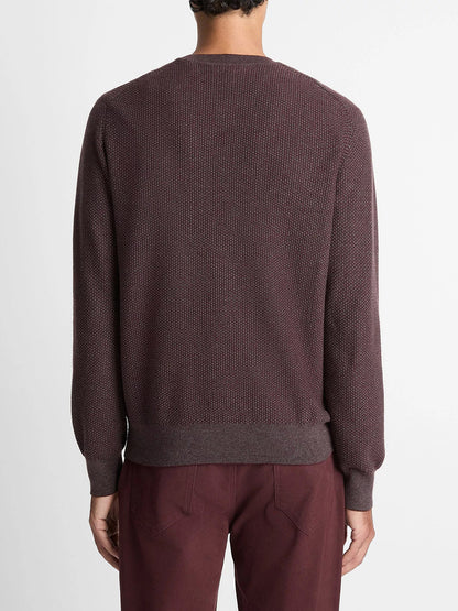 A person stands with their back to the camera, wearing the Vince Geo-Jacquard Wool-Blend Crew Neck Sweater in Port/Medium Heather Grey against a plain light background.