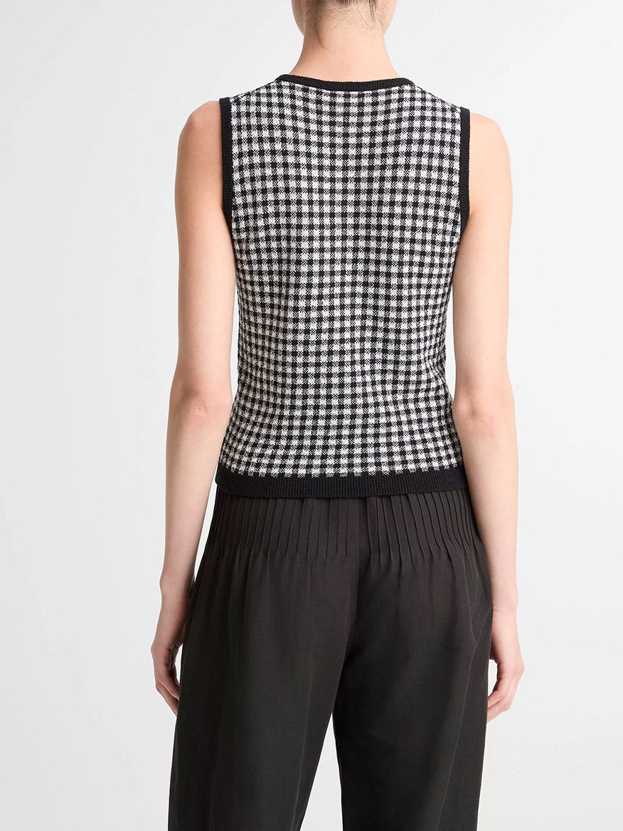 Model wears the Vince Gingham Italian Wool Blend Shell in Black/Off-White and black pleated pants, shown from the back against a plain light background.