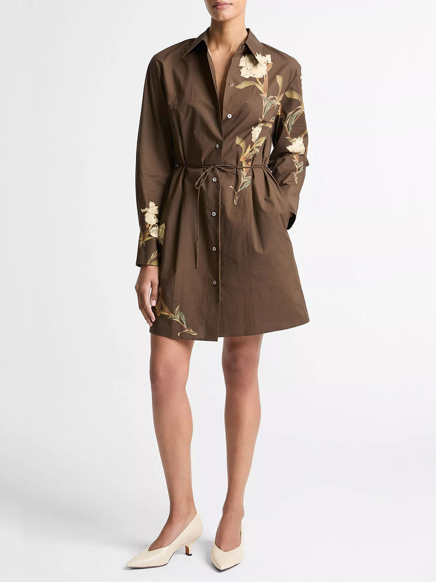 Wearing the Vince Placed Iris Cotton Shirt Dress in Dark Bark, paired with cream-colored low-heeled shoes.