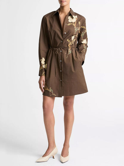 Wearing the Vince Placed Iris Cotton Shirt Dress in Dark Bark, paired with cream-colored low-heeled shoes.