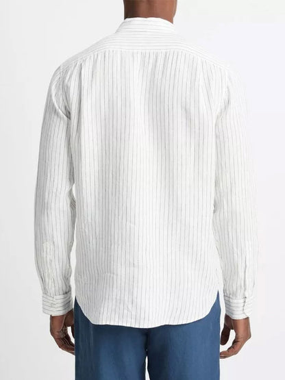 A person seen from behind wearing a Vince Bayside Stripe Linen Long-Sleeve Shirt in Optic White/Deep Indigo and blue jeans.