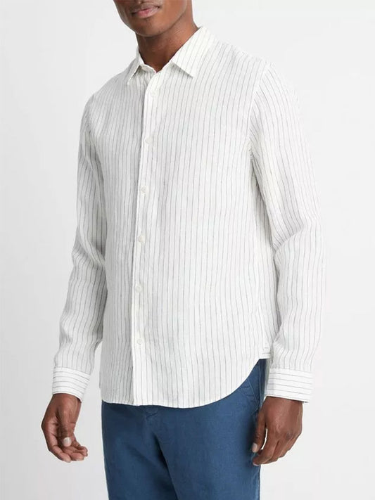 A man wearing a Vince Bayside Stripe Linen Long-Sleeve Shirt in Optic White/Deep Indigo and blue jeans.