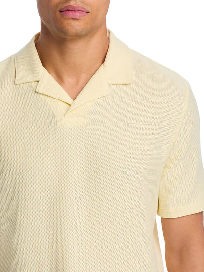 A man models the Vince Macro Honeycomb Cabana Johnny Collar Shirt in Cream, a light cotton-blend knit with textured detail, shown from shoulders to mid-torso against a white background.