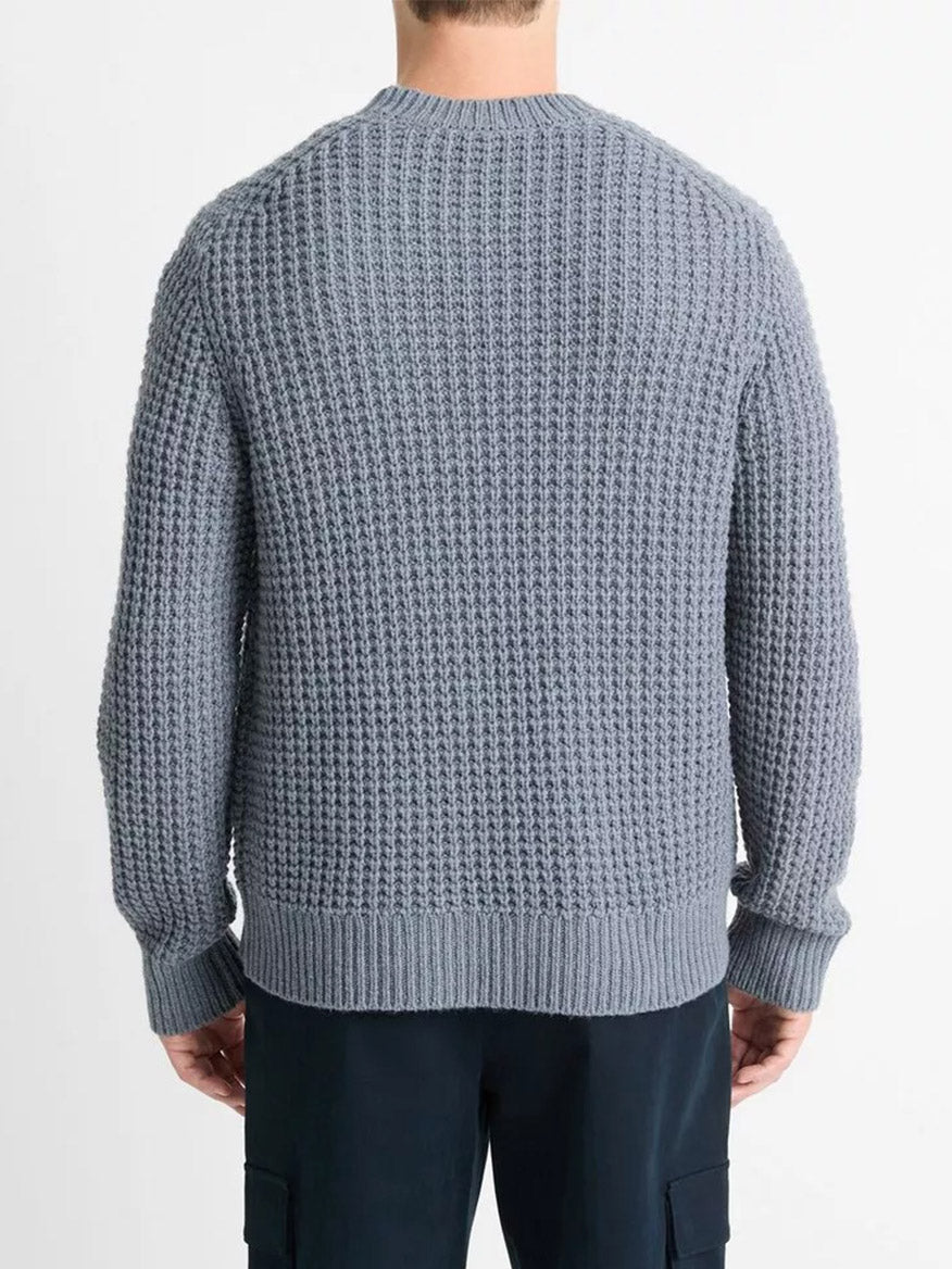 Back view of a person wearing the Vince Macro-Waffle Crew Neck Sweater in Evening Mist with dark pants against a plain background.