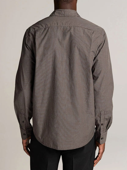 A person is shown from the back against a plain, light background, wearing the Vince McDermott Plaid Cotton Button-Front Shirt in Arabica/Headline Grey and black pants.