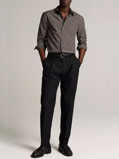 A person stands against a plain background, wearing the Vince McDermott Plaid Cotton Button-Front Shirt in Arabica/Headline Grey, paired with black dress pants, a belt, and black dress shoes. Their hands are in their pockets and their face is not visible.