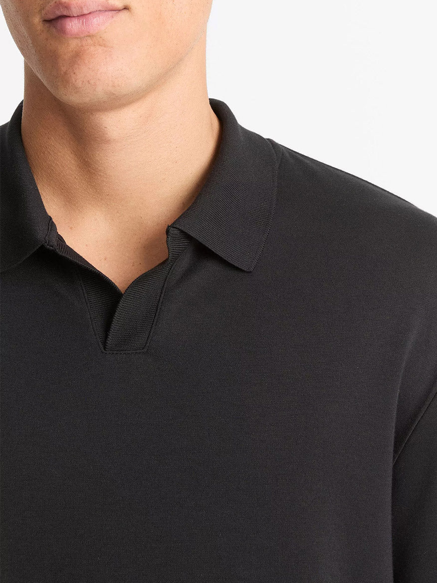 A person wearing the Vince Milano Pima Cotton-Blend Johnny-Collar Shirt in black, shown from the shoulders up against a plain white background.
