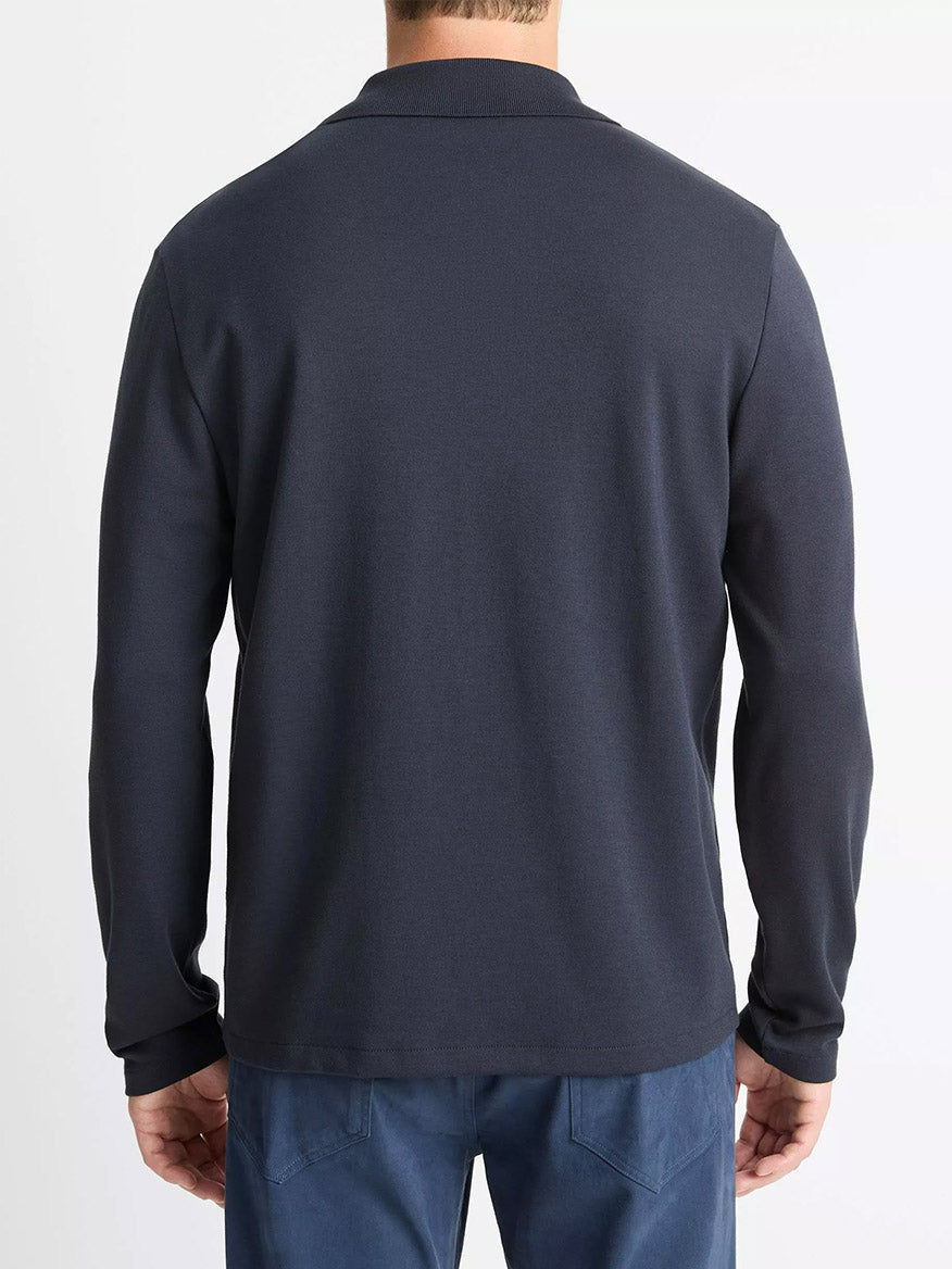 The image shows a person from the back, dressed in a Vince Milano Pima Cotton-Blend Johnny-Collar Shirt in Coastal Blue, paired with blue pants against a plain light background.