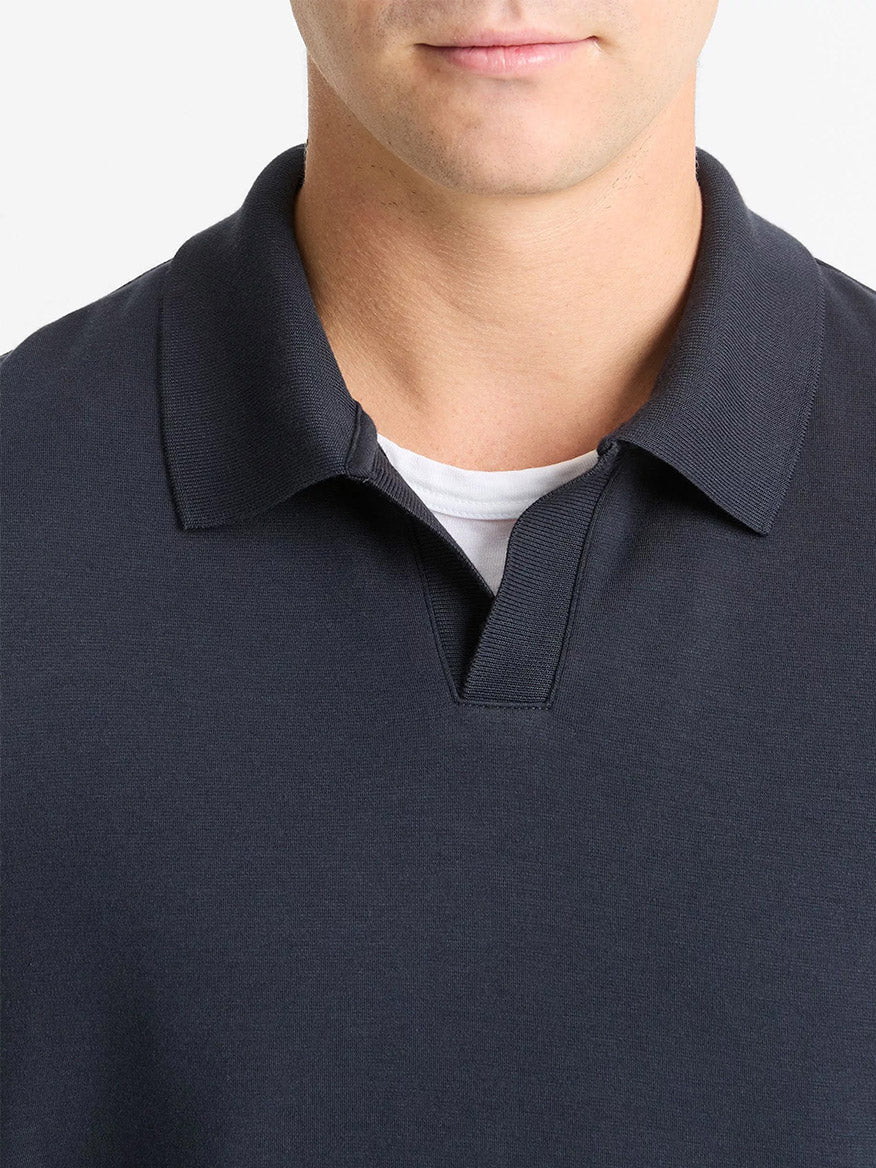 A person wears the Vince Milano Pima Cotton-Blend Johnny-Collar Shirt in Coastal Blue over a white undershirt, shown from shoulders to just below the nose against a plain background.