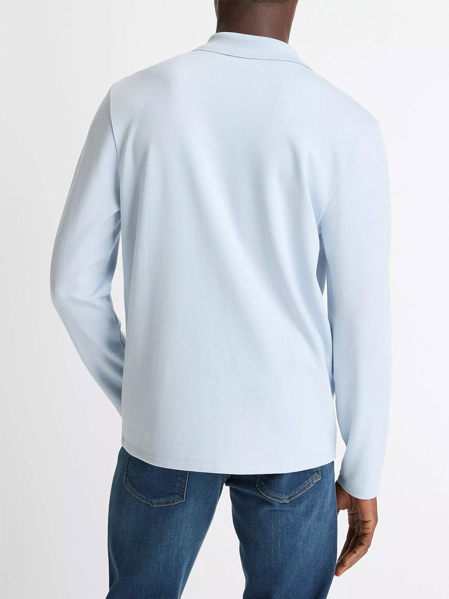 A person is shown from the back against a plain background, wearing the Vince Milano Pima Cotton-Blend Johnny-Collar Shirt in Whitecap paired with blue jeans.