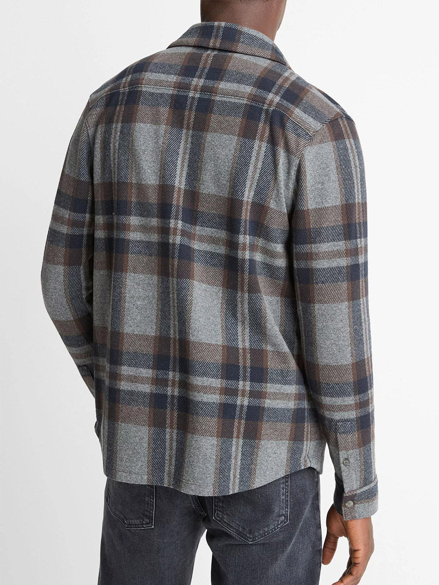 A person is shown from the back, wearing the Vince Plaid Cotton-Blend Shirt Jacket in Medium Heather Grey Combo with dark jeans against a plain white background.