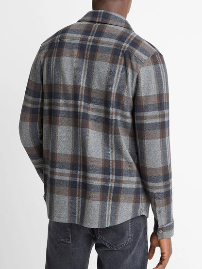 A person is shown from the back, wearing the Vince Plaid Cotton-Blend Shirt Jacket in Medium Heather Grey Combo with dark jeans against a plain white background.