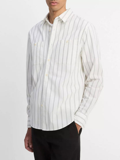 A man wearing the Vince Port Stripe Cotton Button-Front Shirt in Off White/Smoke and black pants stands against a plain background.
