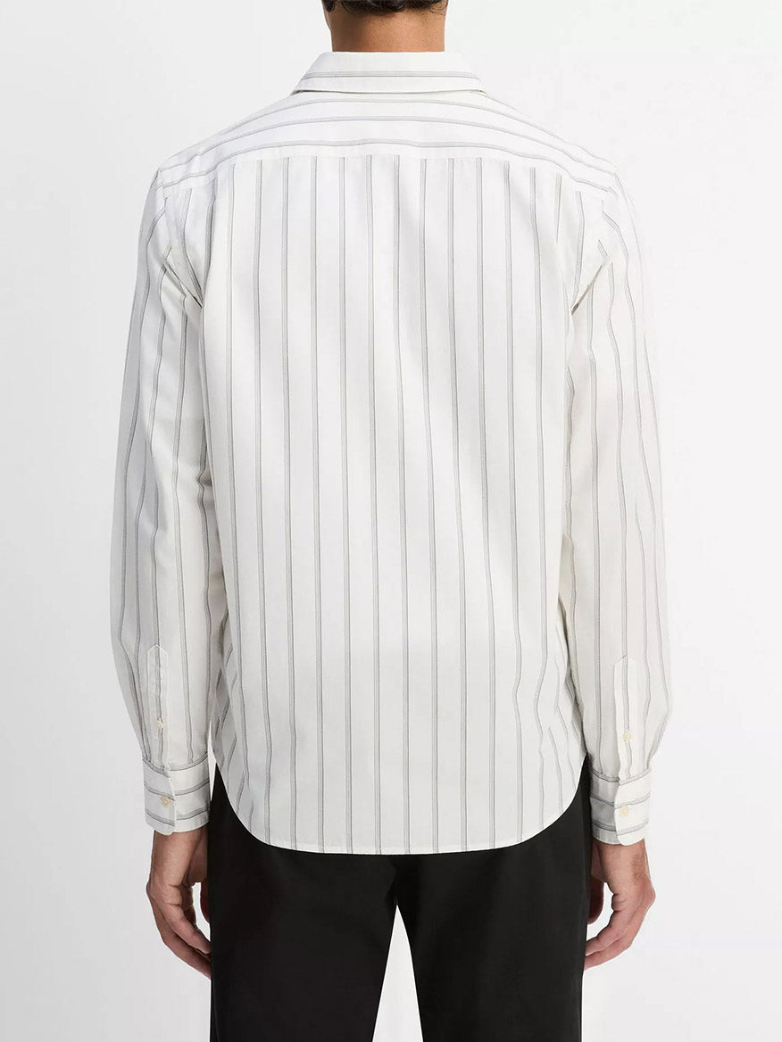 A person is seen from the back wearing the Vince Port Stripe Cotton Button-Front Shirt in Off White/Smoke, a long-sleeved transitional staple with vertical gray stripes.