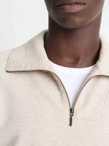 A person is wearing a Vince Cotton-Blend Mock Neck Quarter-Zip Pullover in Heather Sheep over a white shirt, partially visible from the shoulders up.