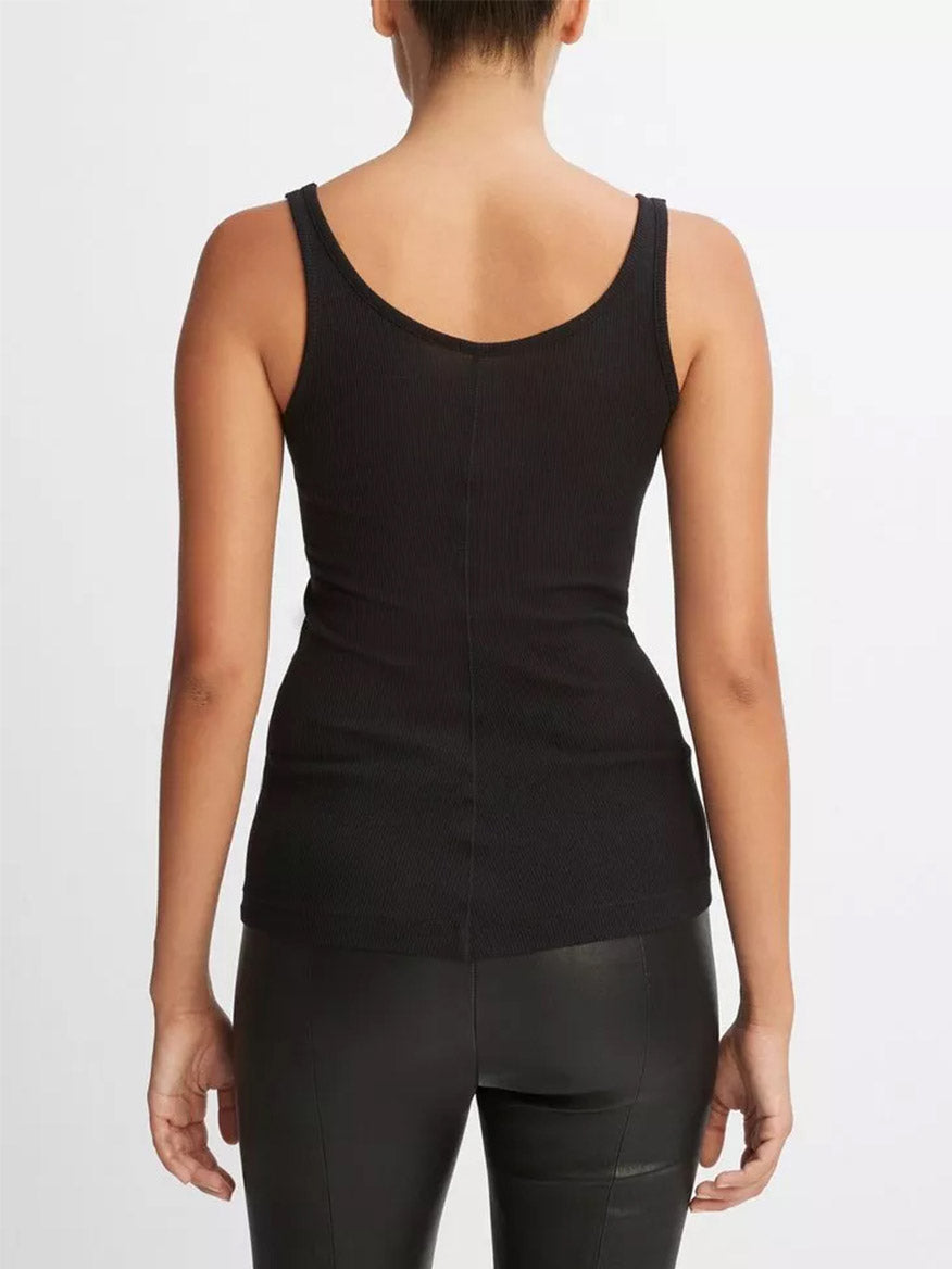 Woman from behind wearing a Vince Scoop Neck Tank in Black and leggings.