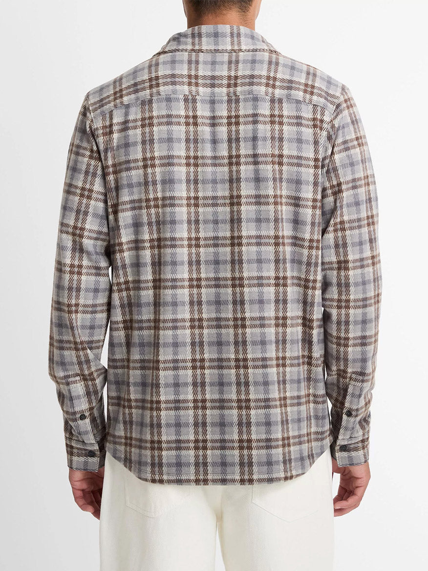 A person shown from the back, wearing the Vince Plaid Cotton-Blend Shirt Jacket in Heather Fog Combo with white pants, against a plain white background.
