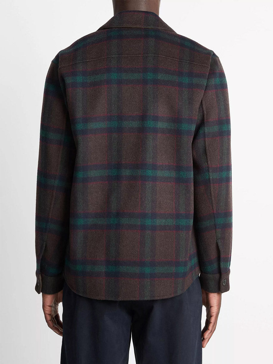 A person is seen from behind wearing the Vince Plaid Splittable Wool-Blend Shirt Jacket in Coastal Country Racer and dark pants, set against a plain white background.