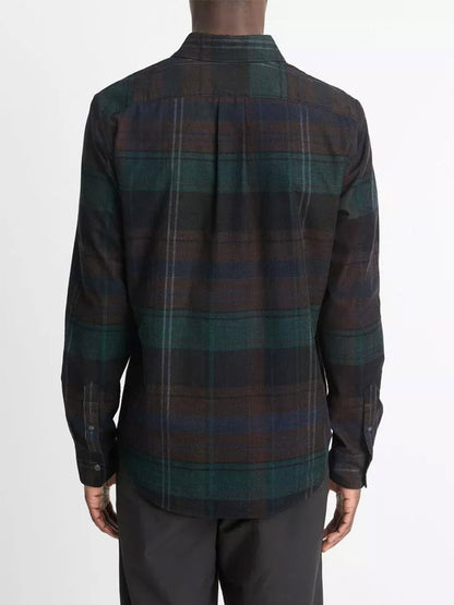 The image features an individual wearing a Vince Sierra Plaid Cotton Corduroy Shirt in Surplus Olive/Ivy Sky paired with black pants, viewed from the back against a plain background.