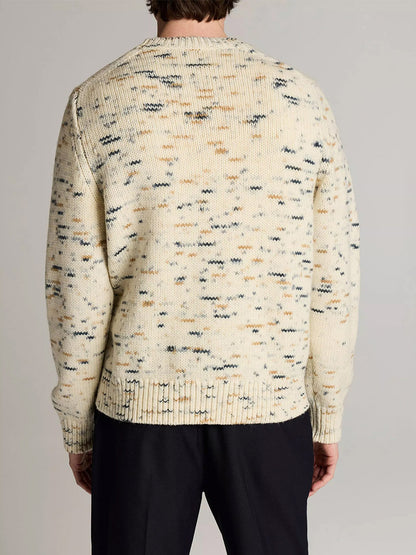 A person wearing the Vince Super Space-Dye Merino Wool Sweater in Bone Combo with black pants, shown from the back against a neutral background.