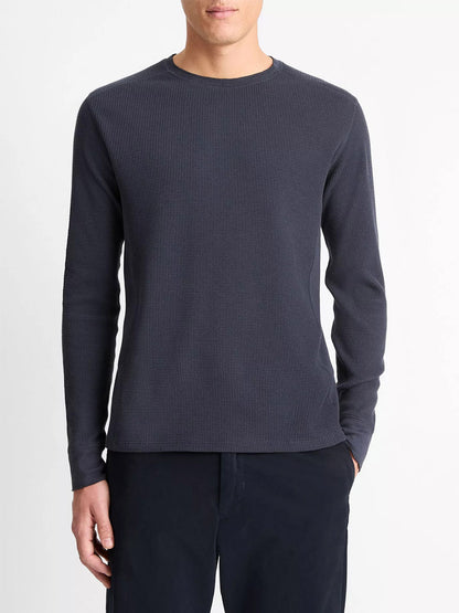 Wearing the Vince Thermal Long Sleeve Crew Neck Pullover in Coastal Blue, this person stands in dark pants against a plain white background.