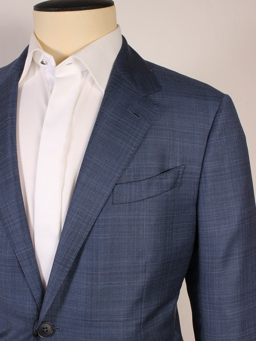 A mannequin wears the Zegna High Performance Bright Blue Suit jacket, featuring a blue plaid pattern, over a white dress shirt with the top button undone.