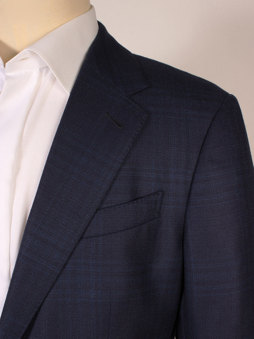 Close-up of a person wearing a white dress shirt and the Zegna 15MILMIL Navy Window Plaid Sport Jacket, made in Italy.