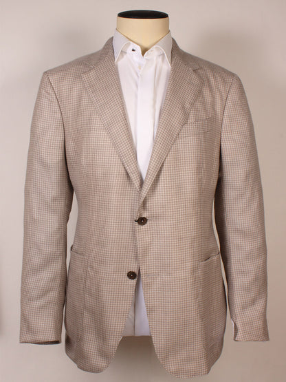The Zegna Cream Houndstooth Cashmere Blend Sport Jacket, made in Italy, features notch lapels, two brown buttons, patch pockets, and is shown with a white dress shirt on a mannequin.