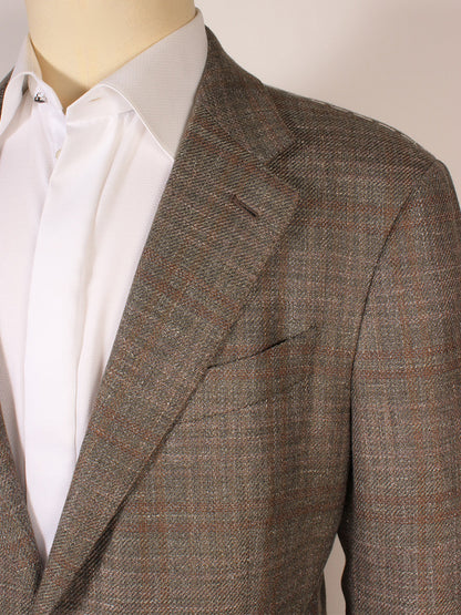 A mannequin in a light brown plaid blazer over a white dress shirt stands beside the Zegna Fairway Winter Crossover Sport Jacket in hunter green plaid, made in Italy.