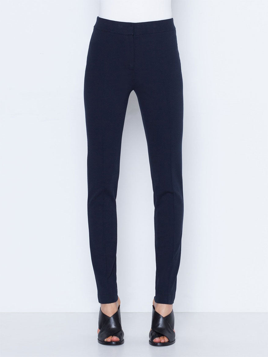 Akris Punto Mara Stretch Jersey Pants in Navy, paired with black open-toe sandals.