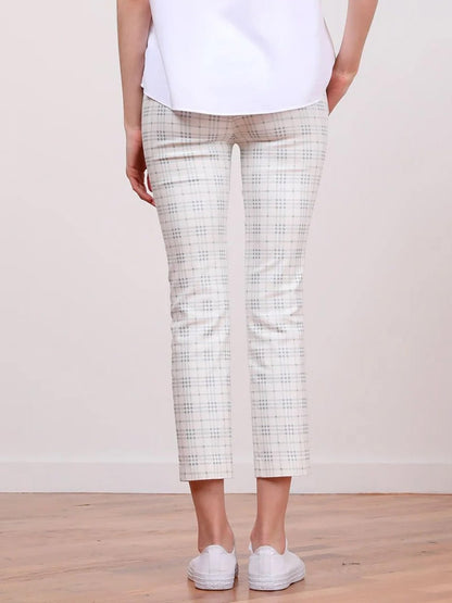 A woman's legs and bottom of an Avenue Montaigne Lulu Plaid Blue Ankle Slim Pant, featuring side pockets.
