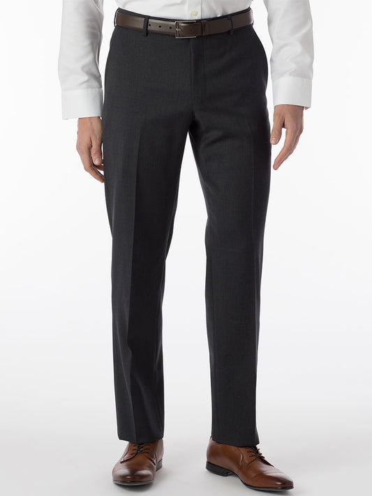 A man is standing in Ballin Theo Comfort 'EZE' Modern Flat Front Pant in Charcoal, made of wool gabardine fabric, featuring a Comfort "EZE" waistband.