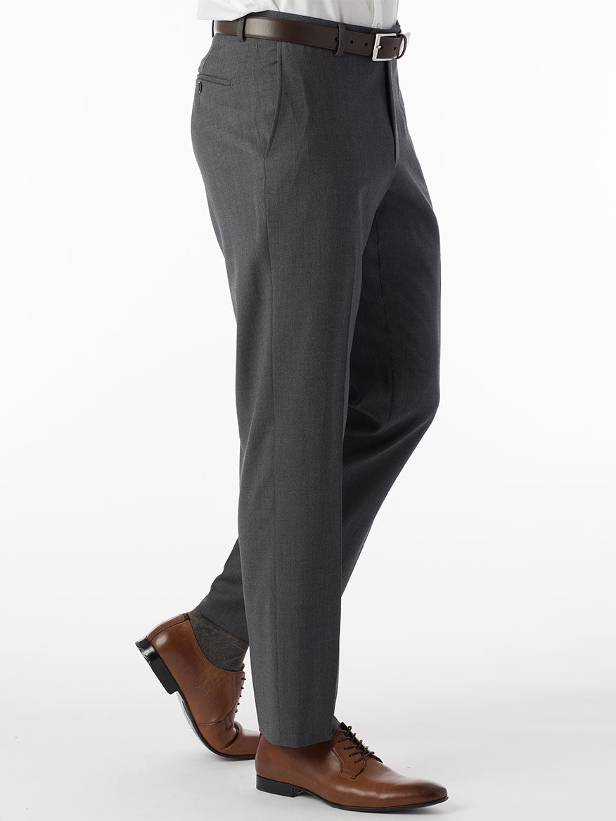 A man in a "Ballin Theo Comfort 'EZE' Modern Flat Front Pant in Mid Grey" gray suit is standing on a white background.