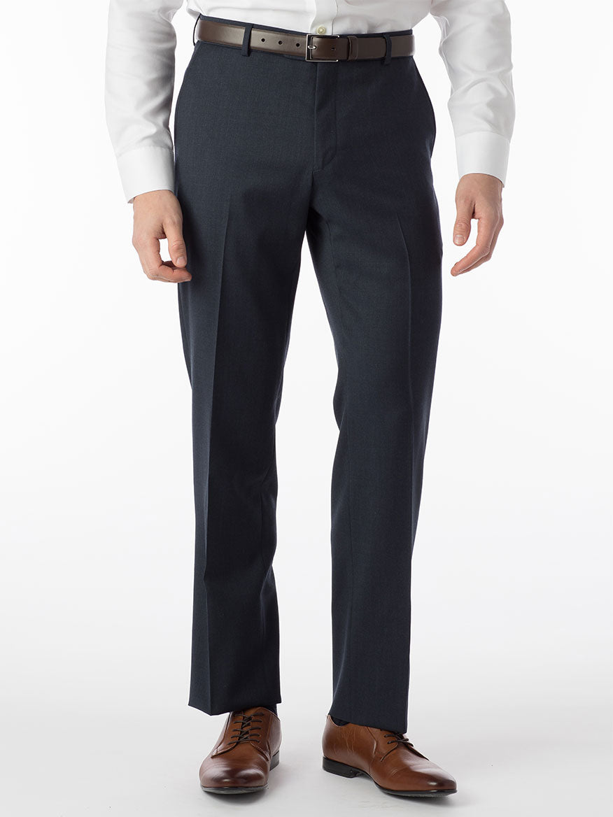 A man is standing in a wool gabardine dress shirt and Ballin Theo Comfort 'EZE' Modern Flat Front Pant in Navy Mix.