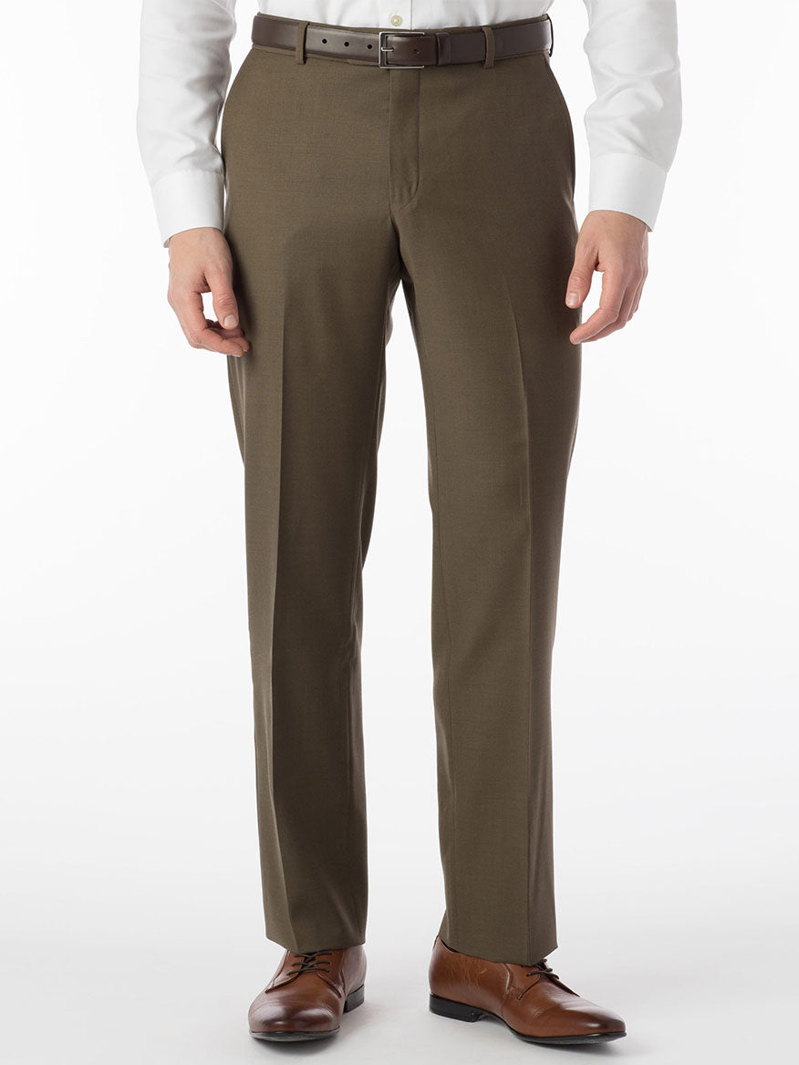 A man in Ballin Soho Comfort 'EZE' Super 120s Modern Flat Front Pant in Olive dress pants showcases a luxurious white shirt.