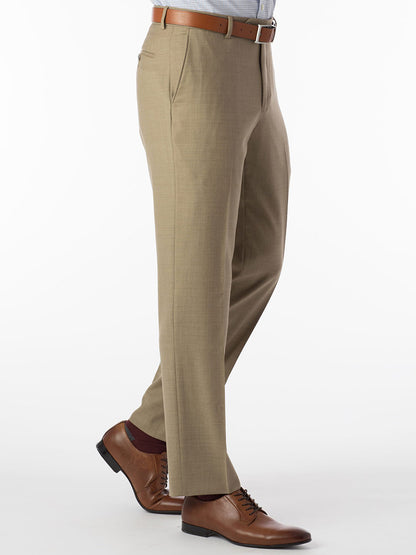 A man is standing in a Ballin Soho Comfort 'EZE' Super 120s Modern Flat Front Pant in Tan suit pants.