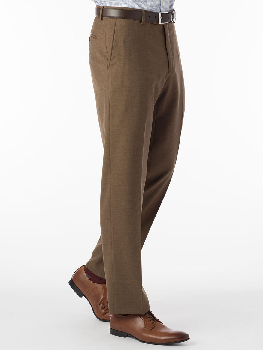 A man wearing the Ballin Soho Comfort 'EZE' Super 120s Modern Flat Front Pant in Tobacco dress pants and a tan shirt.