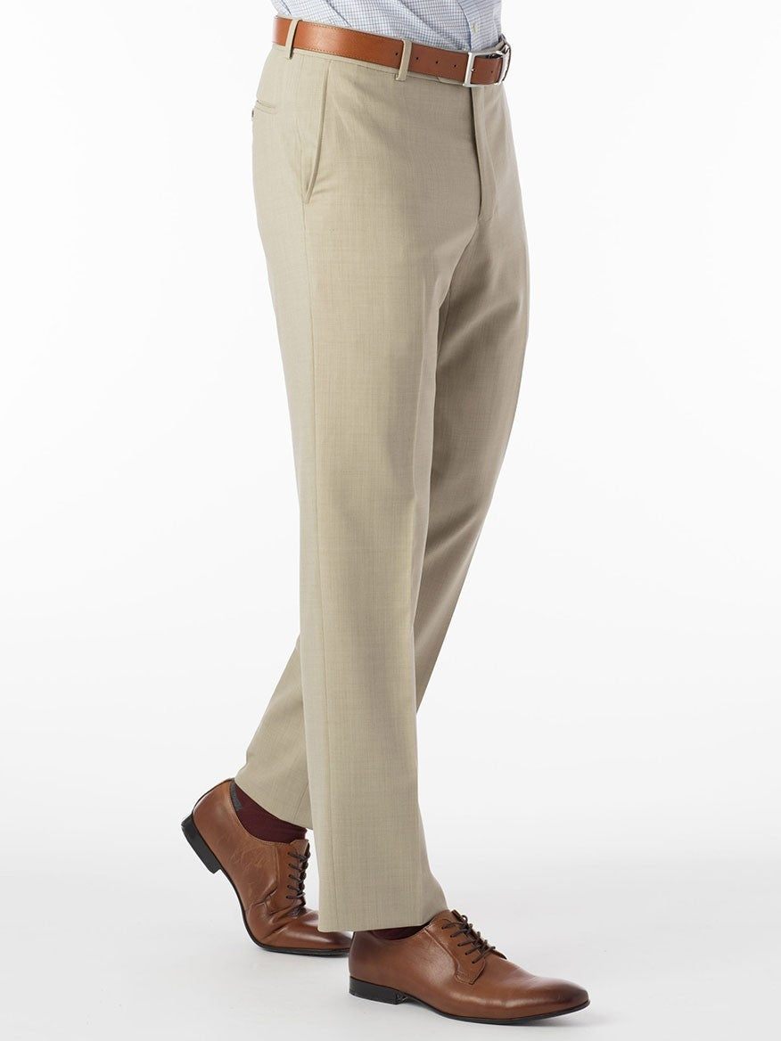 A Ballin Soho Comfort 'EZE' Super 120s Modern Flat Front Twill Pant in Khaki man in a tan suit is standing on a white background.
