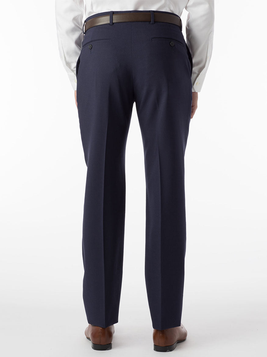 The back view of a man wearing a Ballin Soho Comfort 'EZE' Super 120s Modern Flat Front Twill Pant in New Navy suit with a Comfort "EZE" waistband.