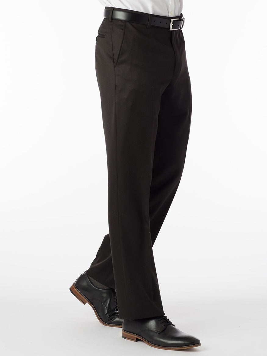 A man wearing Ballin Dunhill Micro Nano Traditional Flat Front Pant in Black dress pants and a white shirt with stretch fabric.