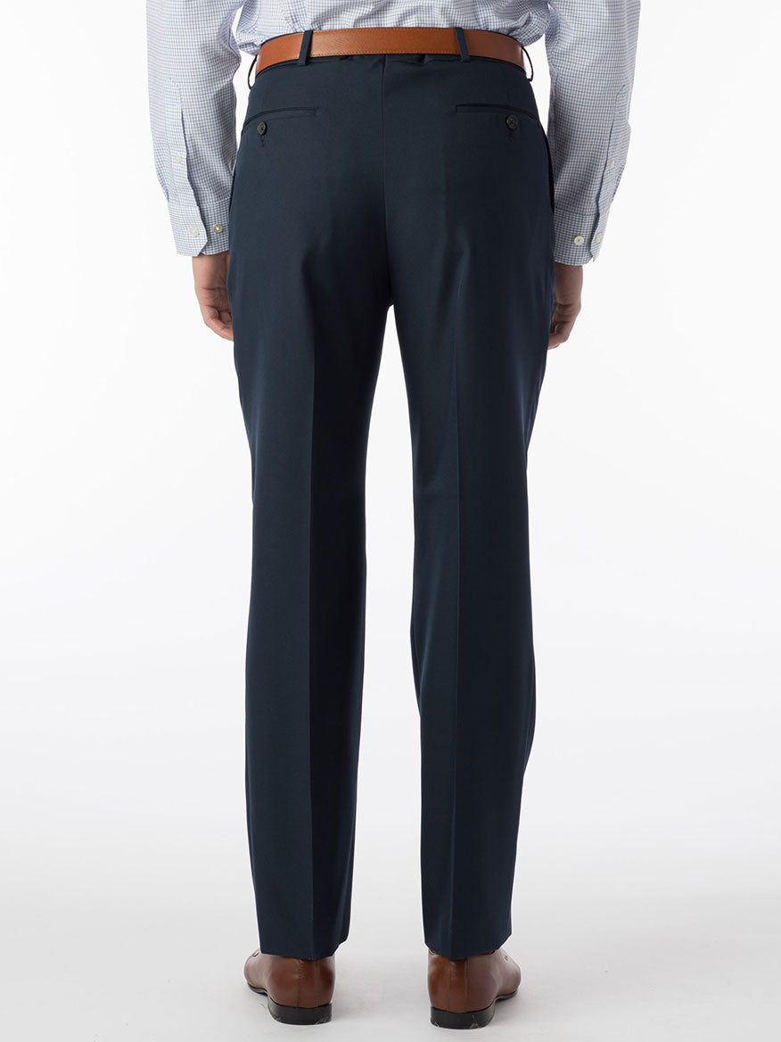 The back view of a man wearing Ballin Dunhill Micro Nano Traditional Flat Front Pant in Navy made with breathable fabric.