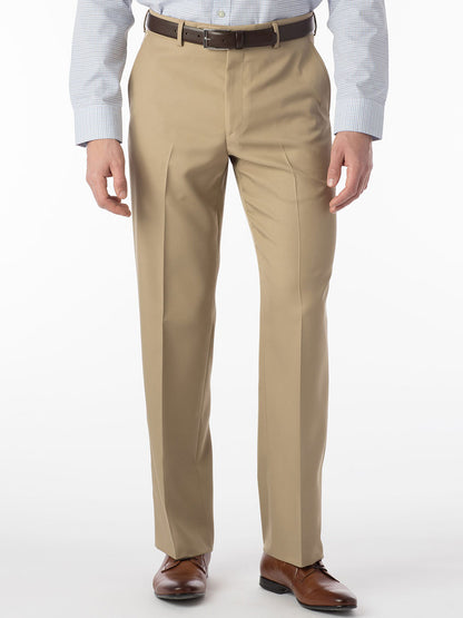 A man wearing Ballin Dunhill Micro Nano Traditional Flat Front Pant in Tan and a white shirt.